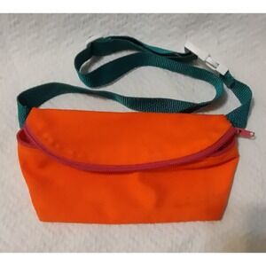 Bright orange fanny pack with green waist band